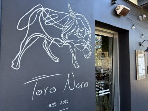 Finished freehand bull logo mural at Toro Nero restaurant in Mona Vale